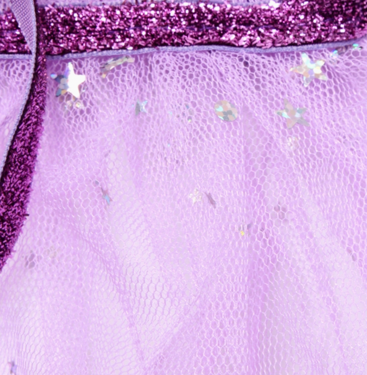 Lilac Molly & Rose children’s net cape, shown to highlight the neck tie, with glitter stars and a ruffle collar.