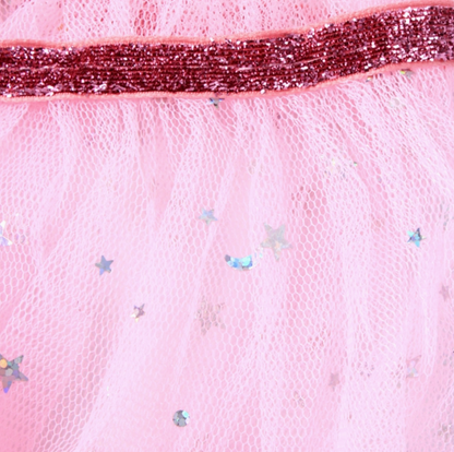 Pink Molly & Rose children’s net cape showing its sparkly glitter neck tie, ruffle collar and glitter star details.
