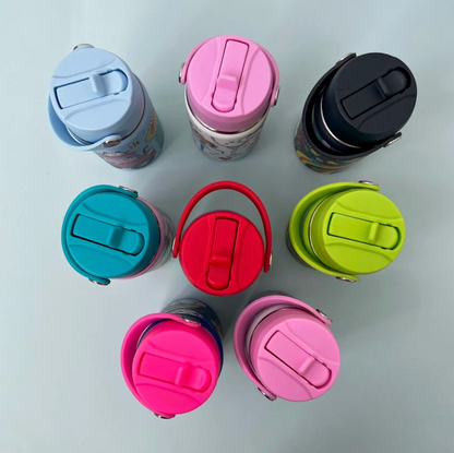 Eight Rachel Ellen bottles viewed overhead on pale blue surface: pale blue, pink and dark navy Space lids across top, turquoise, red and lime green in middle, fuchsia and pale pink below; drinking spouts folded closed and carry handles curved around lids with round silver pivots.