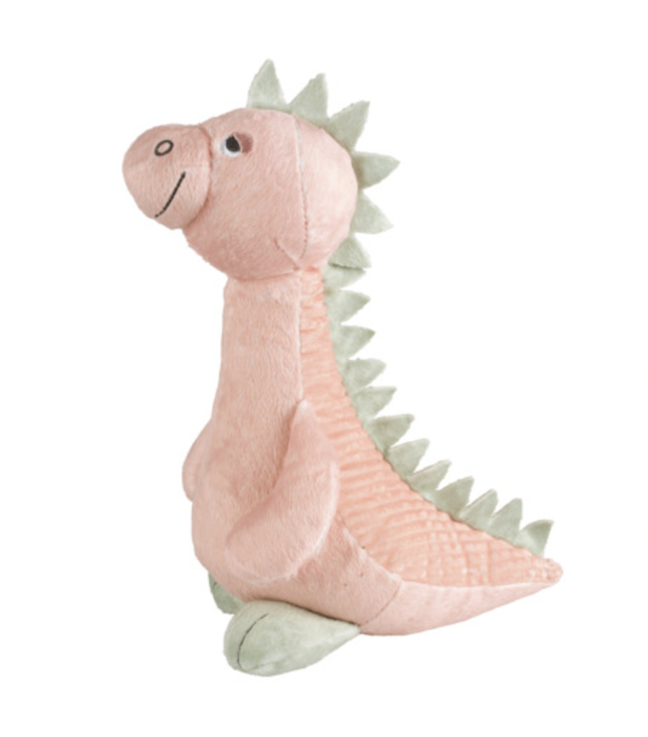 Happy Horse Plesiosaur Pat blush-pink plush soft toy sitting in profile facing left on a white background; long upright neck, rounded muzzle with stitched nostril and curved smile, visible dark eye, soft hanging flipper and tapered tail extending right. Pale sage-green triangular spikes run from the head down the neck and back to the tail, with matching feet beneath the body; fine ribbed texture and stitched panel seams are visible in the pink plush.