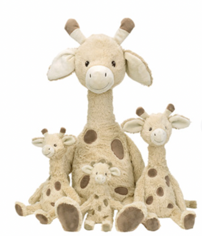 Four Happy Horse Giraffe Gus soft toys in different sizes grouped on a white background: largest seated at centre back, medium giraffe at right, smaller giraffe at left and smallest standing at front centre. All have beige textured plush, taupe-brown spots and feet, long necks, cream muzzles and inner ears, dark eyes, stitched smiles and brown-tipped horns; group shown for size comparison.