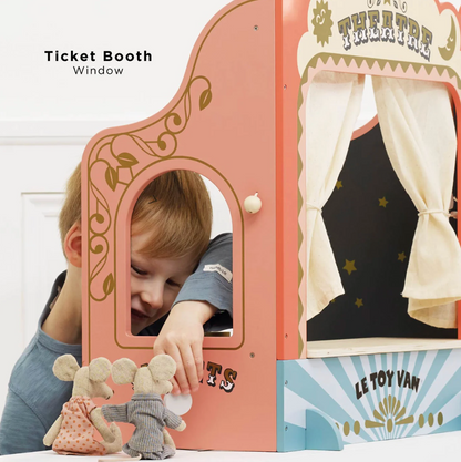 Child playing with a toy theatre set, peering through a 'Ticket Booth Window' with curtains. TABLETOP PUPPET THEATRE | LE TOY VAN