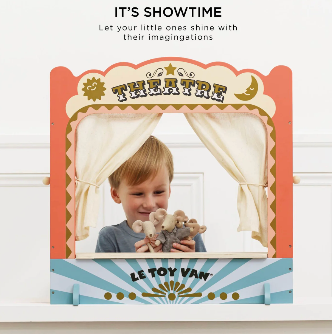 Children's theatre set with a young boy holding teddy bears, featuring Le Toy Van branding.
