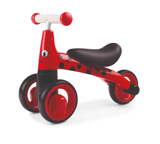 Red and black balance bike with a smiling face. TODDLER RIDE ON TOY - LADYBIRD | DIDITRIKE 