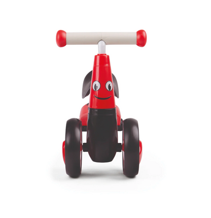 Red and black toy bike with a smiling face on. TODDLER RIDE ON TOY - LADYBIRD | DIDITRIKE 