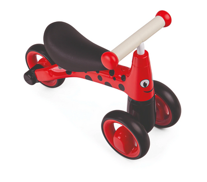 Red and black balance bike with a white handle. TODDLER RIDE ON TOY - LADYBIRD | DIDITRIKE 