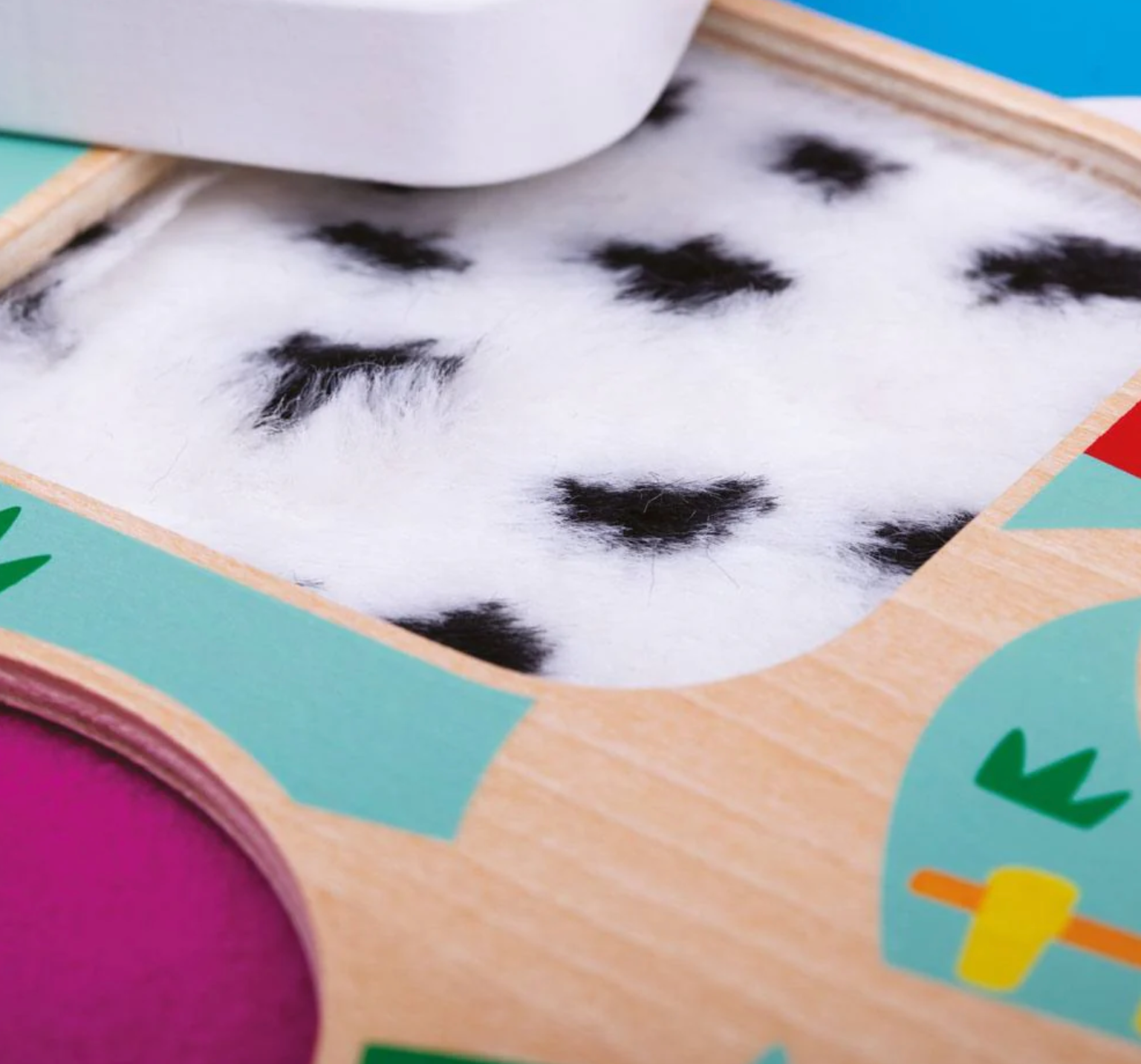 Children's puzzle with animal illustrations on a blue background TOUCH & FEEL FARM PUZZLE | TIDLO