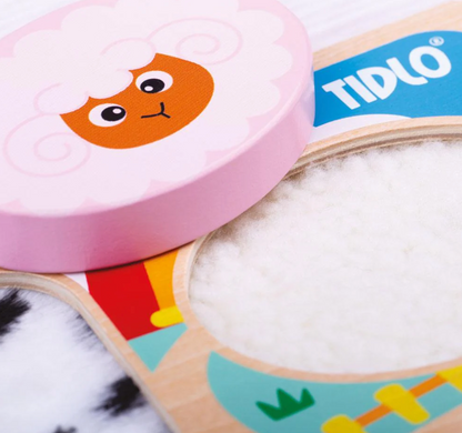 Children's educational toy with colorful animal illustrations and TIDLO branding. TOUCH & FEEL FARM PUZZLE | TIDLO