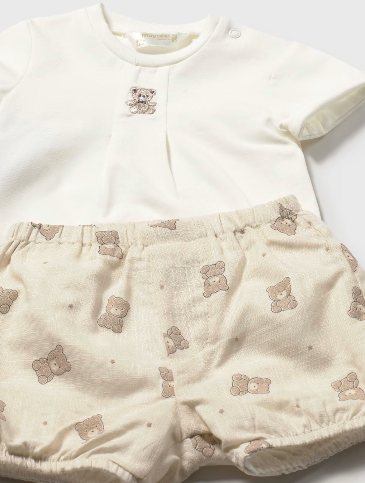 Baby outfit with white top and beige shorts featuring teddy bear patterns . UNISEX NEUTRAL BABY SHORTS & T-SHIRT SET | MAYORAL
