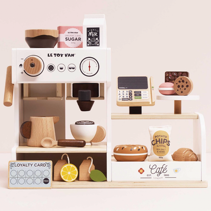 Toy coffee shop set with various items on a white background. WOODEN BARISTA CAFE SHOP | LE TOY VAN