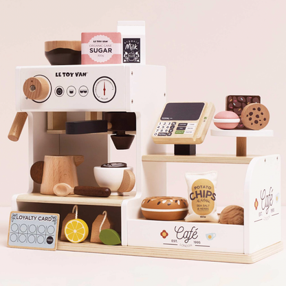 Toy coffee shop set with various items on a white background. WOODEN BARISTA CAFE SHOP | LE TOY VAN