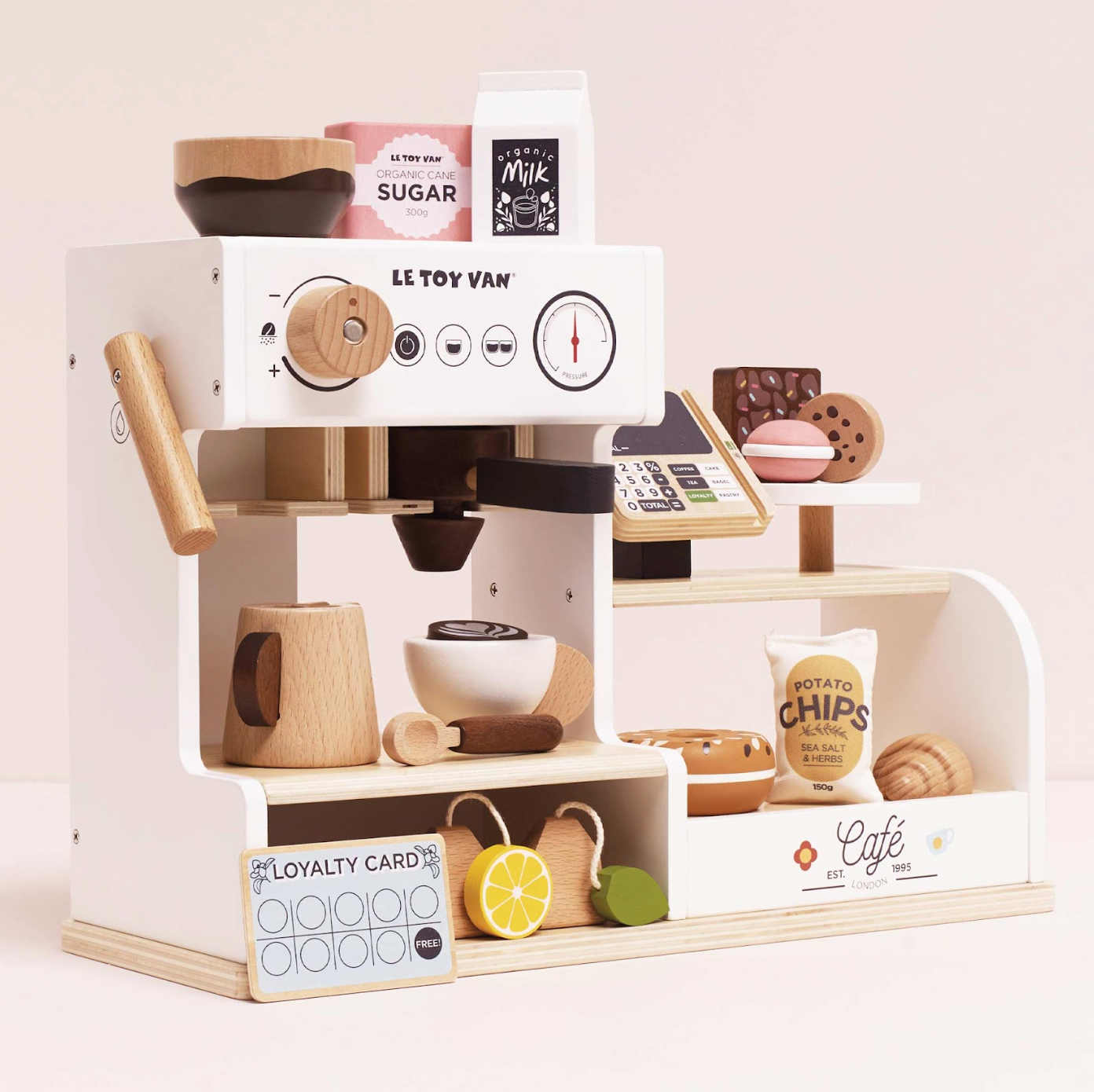 Toy coffee shop set with miniature coffee machine and items on a light pink background WOODEN BARISTA CAFE SHOP | LE TOY VAN