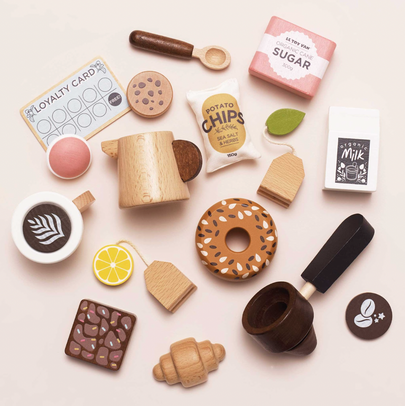 Collection of wooden toys resembling food items and kitchen utensils on a light background. WOODEN BARISTA CAFE SHOP | LE TOY VAN