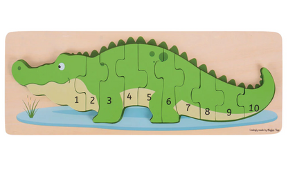 Wooden puzzle shaped like a green alligator with numbered pieces. WOODEN CROCODILE NUMBER COUNTING 1-10 PUZZLE | BIGJIGS