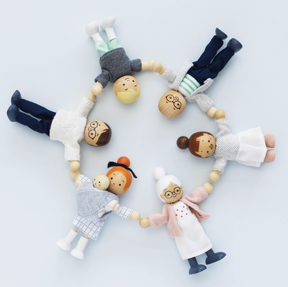 Set of wooden dolls with bead heads arranged in a circle on a light background WOODEN DOLLS HOUSE FAMILY | LE TOY VAN