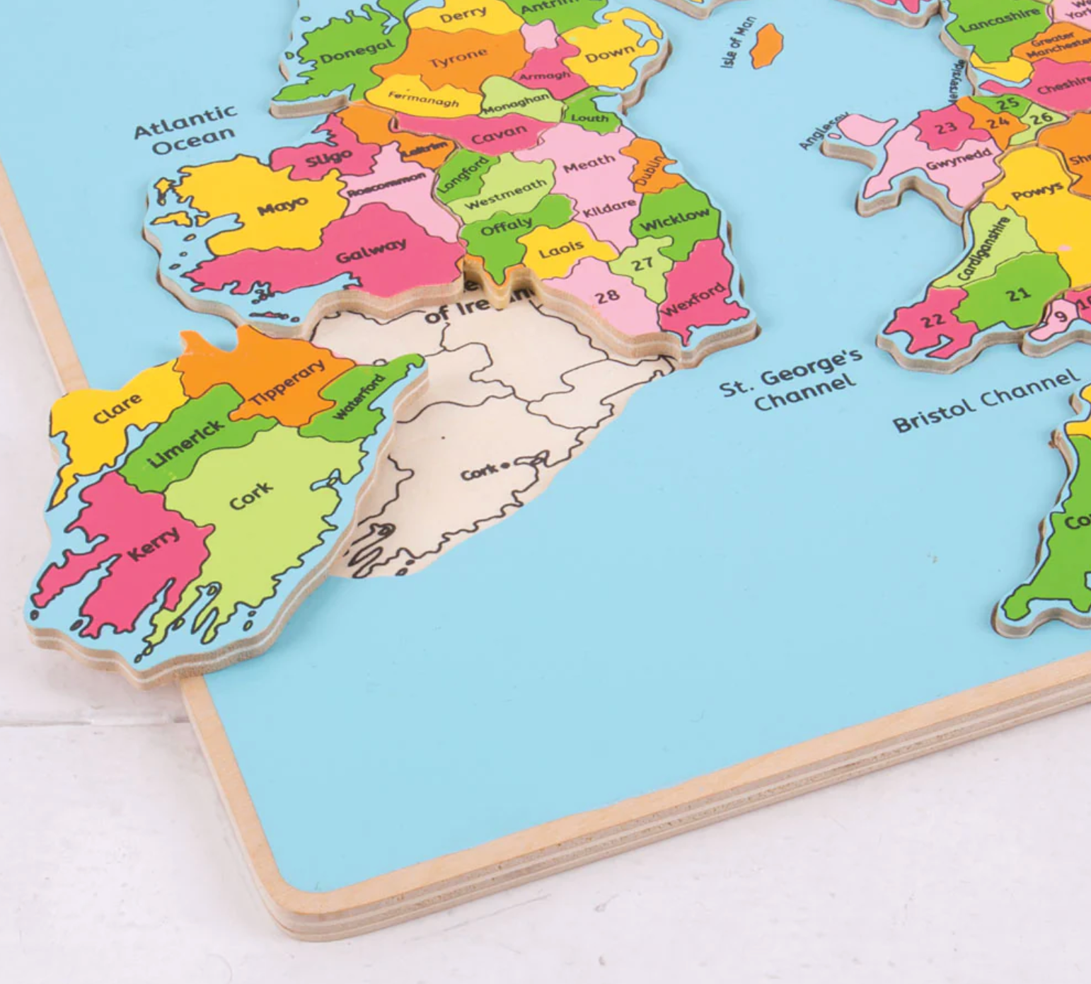 Colorful puzzle map of Ireland on a light blue background. WOODEN EDUCATIONAL BRITISH ISLES INSET PUZZLE | BIGJIGS