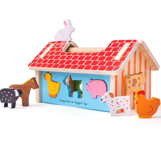Wooden toy barn with animal figures on a white background WOODEN FARMHOUSE SORTER | BIGJIGS