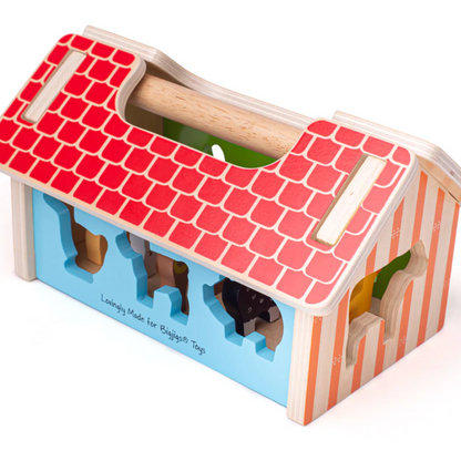 Wooden toy with a red roof and colorful base on a white background WOODEN FARMHOUSE SORTER | BIGJIGS