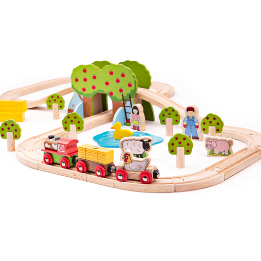 Wooden train set with animals and trees on a white background WOODEN FARM TRAIN SET | BIGJIGS