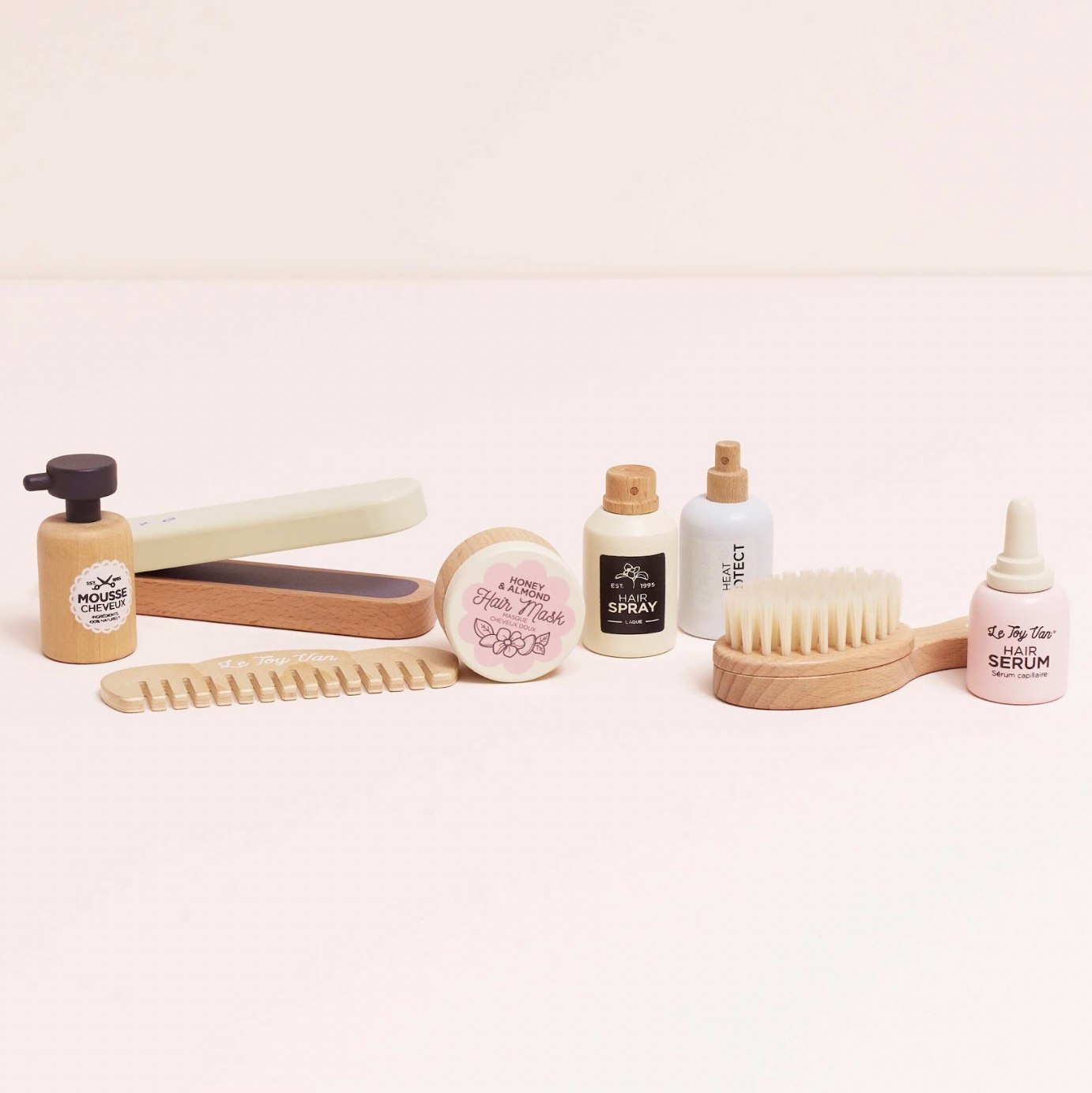 Collection of skincare and hair care products on a white background. WOODEN HAIR STRAIGHTENERS & ACCESSORIES SET | LE TOY VAN