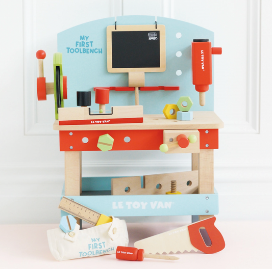 Children's toy toolbench with tools and a chalkboard on a light blue background WOODEN TOOL BENCH | LE TOY VAN 