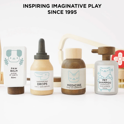 Set of pet care products with labels on a white background, featuring text 'Inspiring Imaginative Play Since 1995'. WOODEN TOY ANIMAL VET SET | LE TOY VAN