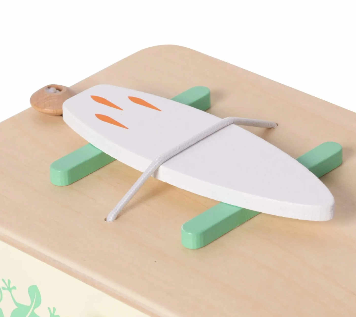 Wooden toy airplane with green wings and orange accents on a beige surface. WOODEN TOY CAMPER VAN PLAYSET | CLASSIC WORLD