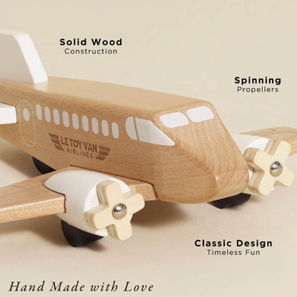 Wooden airplane toy with spinning propellers on a beige background, featuring Le Toy Van branding. WOODEN TOY PLANE | LE TOY VAN