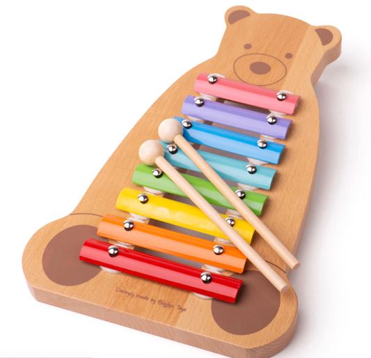 A colorful wooden xylophone in the shape of a bear with eight metal keys in different colors and two wooden beaters. XYLOPHONE BEAR | TIDLO
