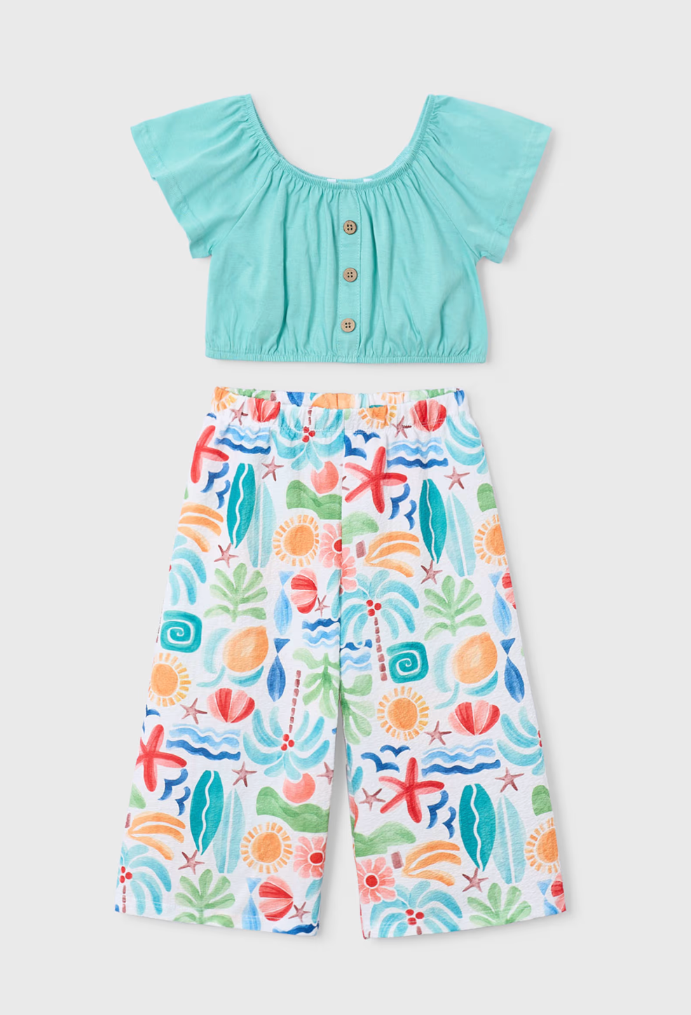 The girls Holiday Oasis wide-leg trouser co-ord set styled beautifully as a premium resort clothing gift for kids.