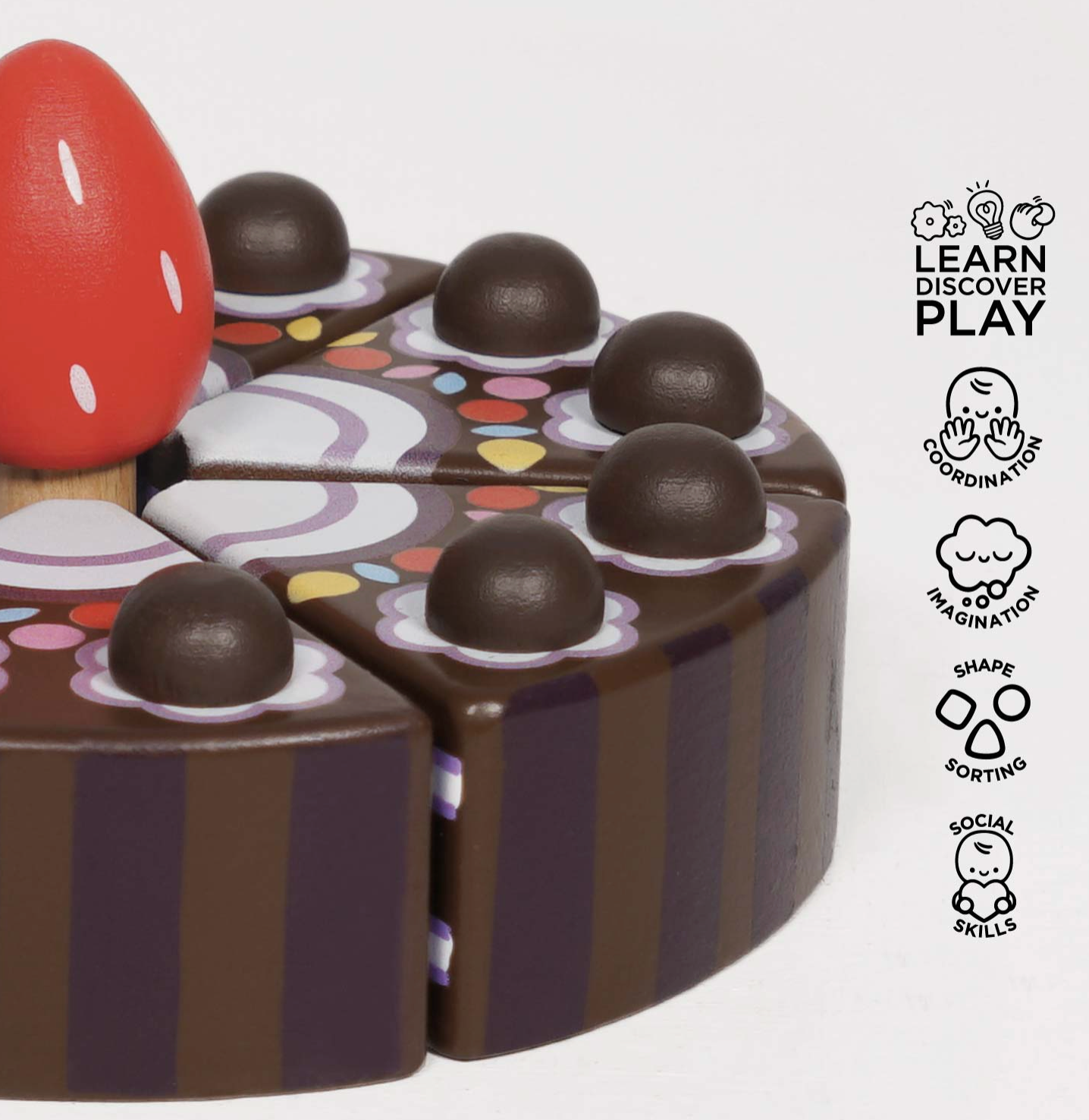 The Le Toy Van chocolate gateau toy cake styled beautifully as a high-quality educational gift for a children's playroom.