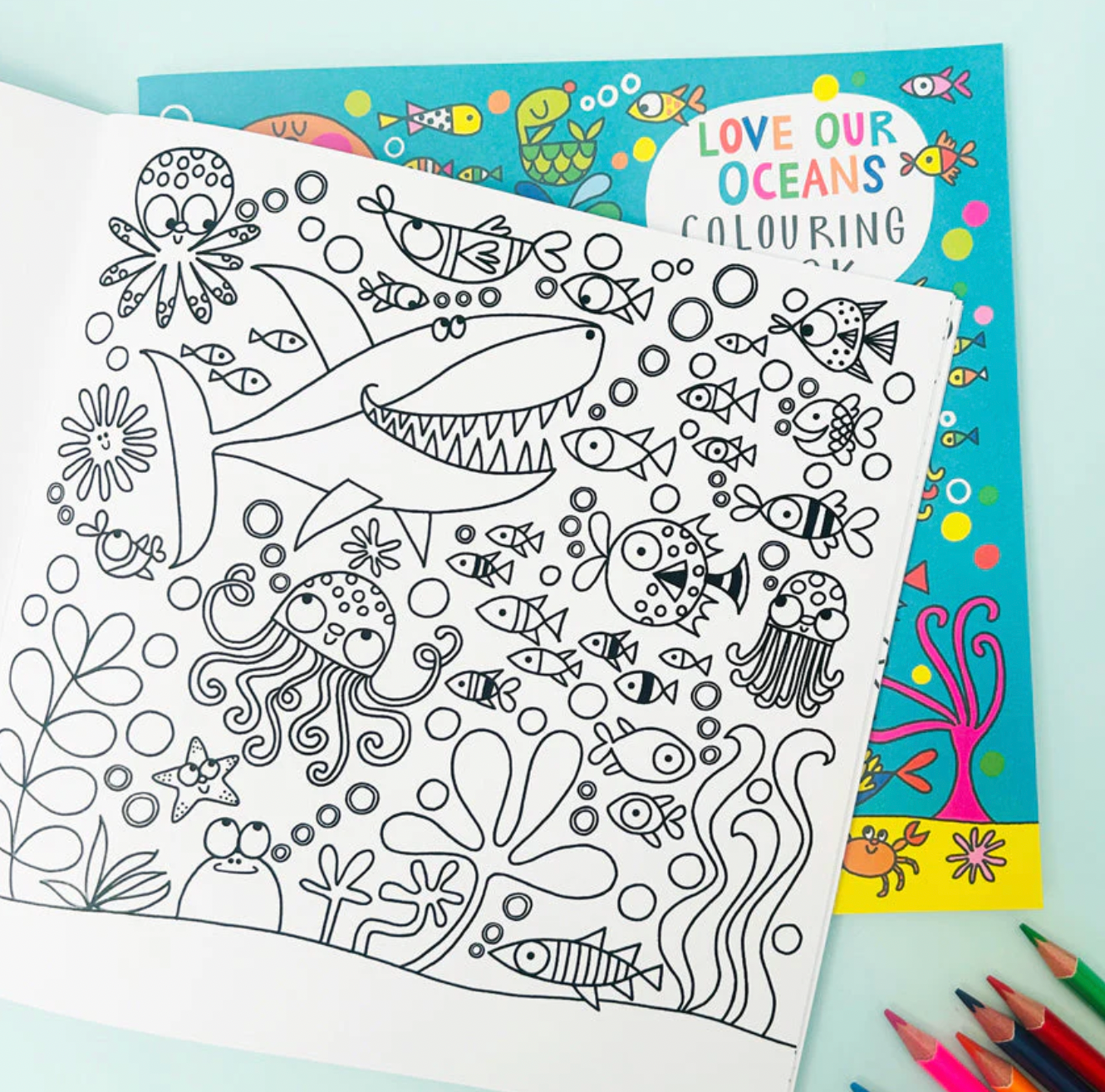 Coloring book with ocean-themed illustrations and 'Love Our Oceans' coloring book cover. Rachel Ellen Love Our Oceans Colouring Book | Annabel's of Cranbrook