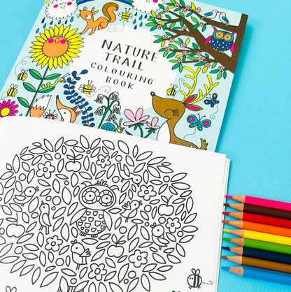 Nature-themed coloring book with a completed coloring page and colored pencils. Rachel Ellen Nature Trail Colouring Book | Annabel's of Cranbrook