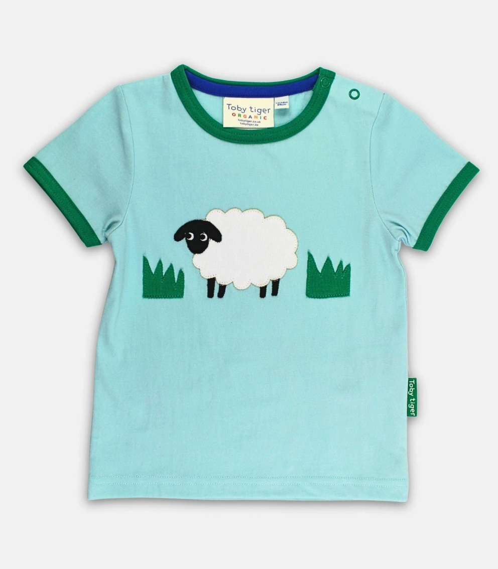 Toby Tiger organic cotton short-sleeved t-shirt in light blue featuring a cute sheep appliqué with green trim.