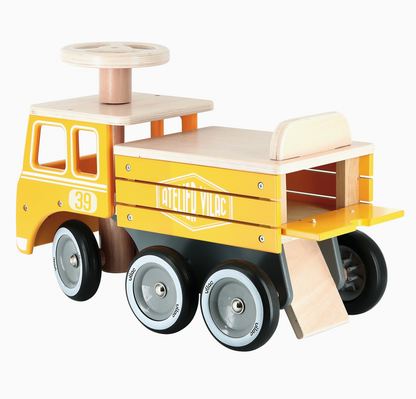Close-up view of the secret under-seat toy storage compartment on the Vilac wooden construction ride-on truck.
